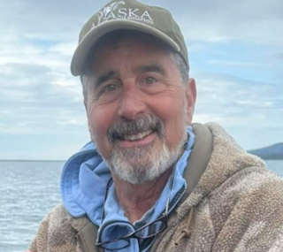 portrait shot of Hap Santoro in front of a lake