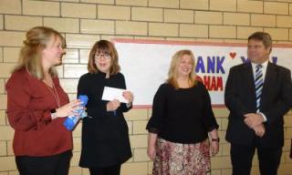 photo of Tammy MacDonald, Susan Haberstroh, Jill Rossetti, and Eric Erskine celebrating receiving a grant
