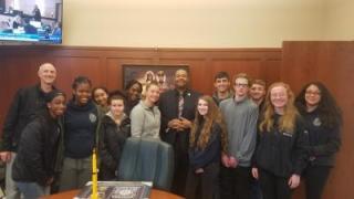 group photo of Criminal Justice students at Boston Police Headquarters