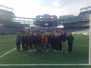 photo of Criminal Justice students standing in the field at Gillette Stadium