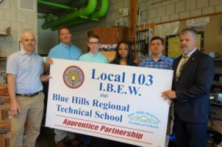 photo of students and electrical instructor standing with business agent for IBEW Local 103