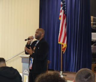 photo of Juma Inniss speaking to students