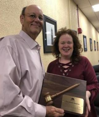 photo of Thomas Polito presenting a plaque to Marybeth Nearen