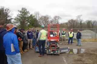 photo of students receiving scissor lift training from industry professionals