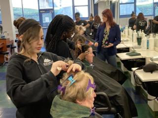 Blue Hills students providing cosmetology services to various clients