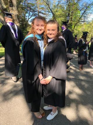 Shannon and Christina Keith posing for a photo outside