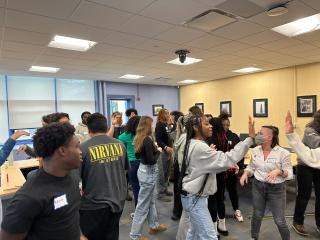 Students engaging in teen speak out event.